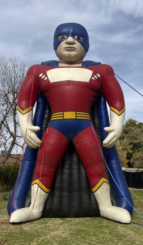 25 ft cold-air inflatable superhero with a blank chest panel for custom branding